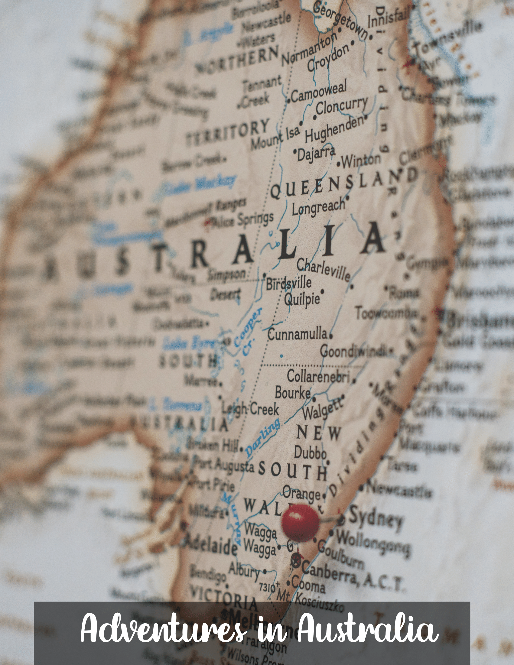 A map of Australia with a red pin marking a location in New South Wales. The phrase "Adventures in Australia Activity Pack by Wondermom Shop" is overlaid at the bottom of the image.