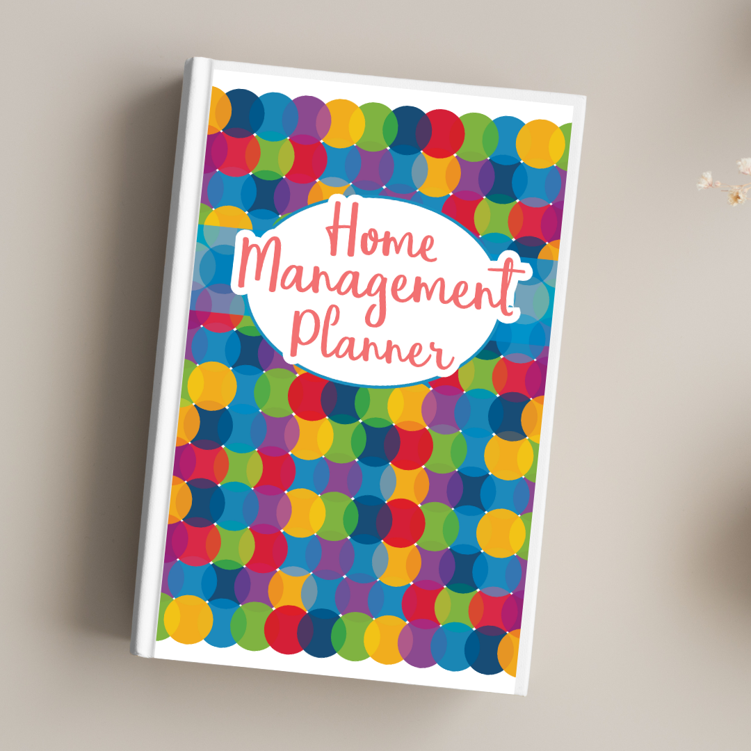 Colorful planner with Wondermom Shop's "Home Management Planner Bundle (Printable & Digital Versions)" text, featuring a multicolored dot pattern cover with a bill payment tracker section, placed on a light surface.