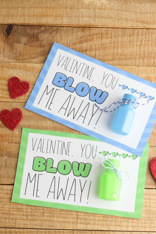 VIP Vault's Bubble Valentines include two cards, each with a bubble bottle. One features a blue striped border, the other green, and both say "Valentine, you blow me away!" decorated with charming red glitter hearts.