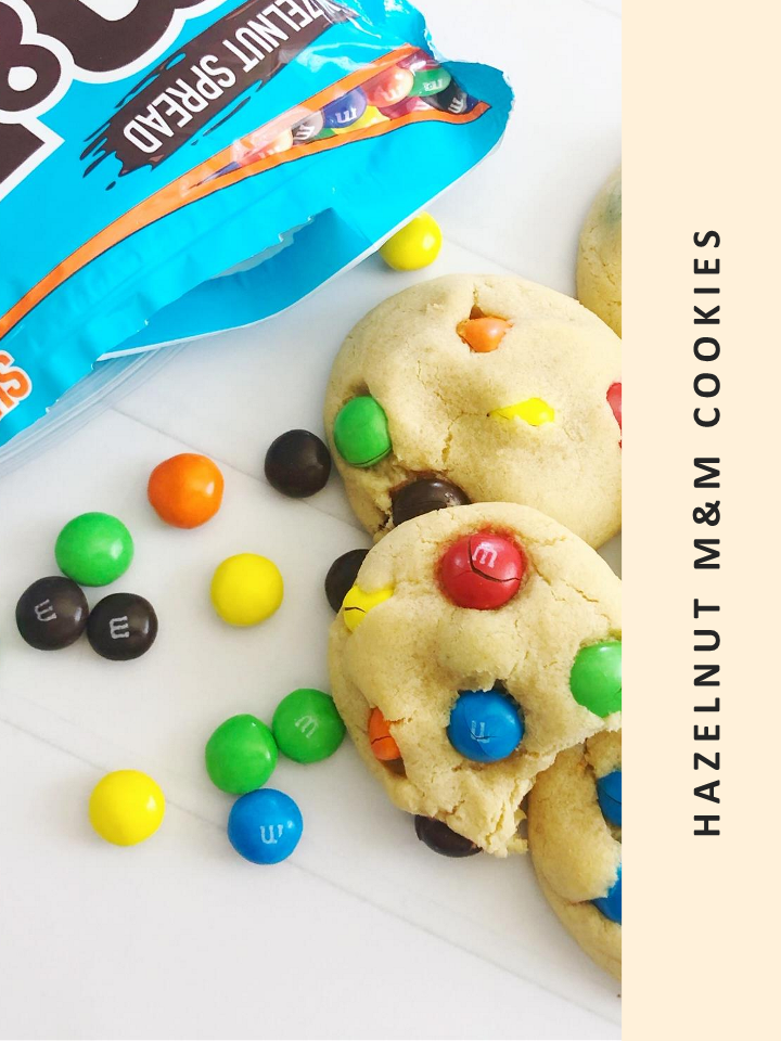 Delicious Wondermom Wannabe's M&M's cookies accompanied by a bag of M&M's.