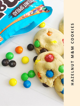 Load image into Gallery viewer, Delicious Wondermom Wannabe&#39;s M&amp;M&#39;s cookies accompanied by a bag of M&amp;M&#39;s.
