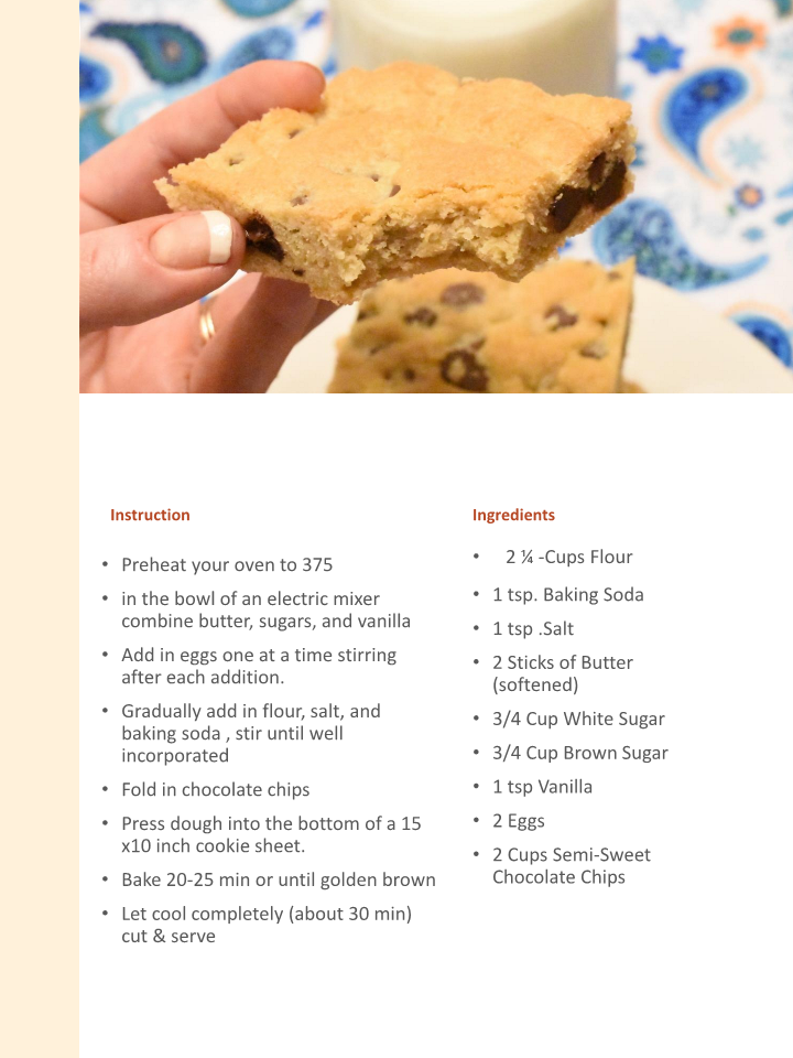 A hand holding a piece of Wondermom Wannabe's Family's Favorite Dessert Recipes Digital Cookbook.