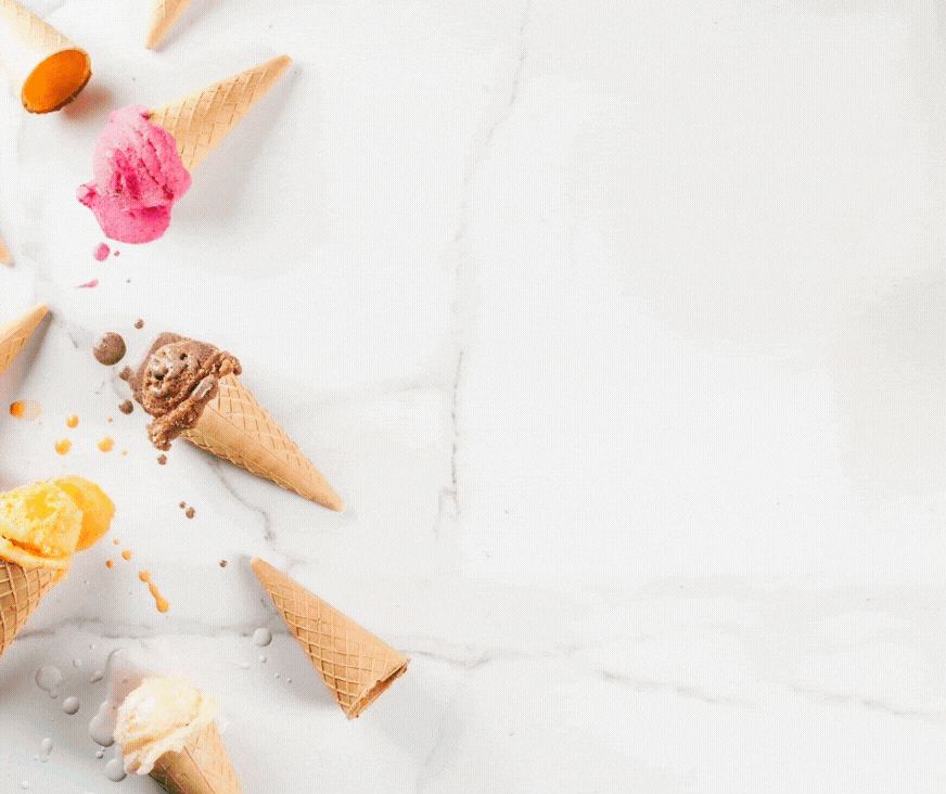 Five fallen ice cream cones with various flavors scattered on a white marble surface, perfect for your Wondermom Shop's Ice Cream Social Party Kit or as a whimsical element in your next event.