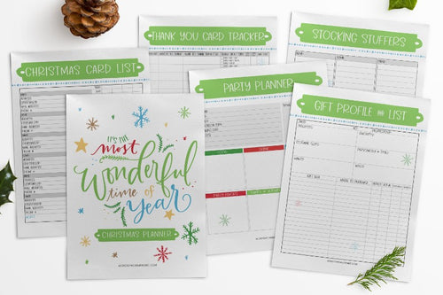 A set of The Most Wonderful Time of the Year Christmas Planners with pinecones and menu planning options from Wondermom Shop.