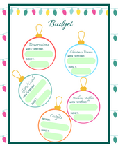 Load image into Gallery viewer, A Christmas Season Planner with ornaments hanging on it from Wondermom Shop.
