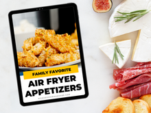 Load image into Gallery viewer, On a marble surface, a tablet displays Wondermom Shop&#39;s &quot;Family Favorite Air Fryer Appetizers&quot; digital cookbook, surrounded by cheese, figs, rosemary, cured meat, and bread—your go-to guide for crispy appetizers.
