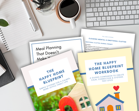 Create your ideal workspace with coffee, notebooks, and the Wondermom Shop's "The Happy Home Blueprint Bundle: Book + Workbook Combo"—the perfect printable set to simplify your home.
