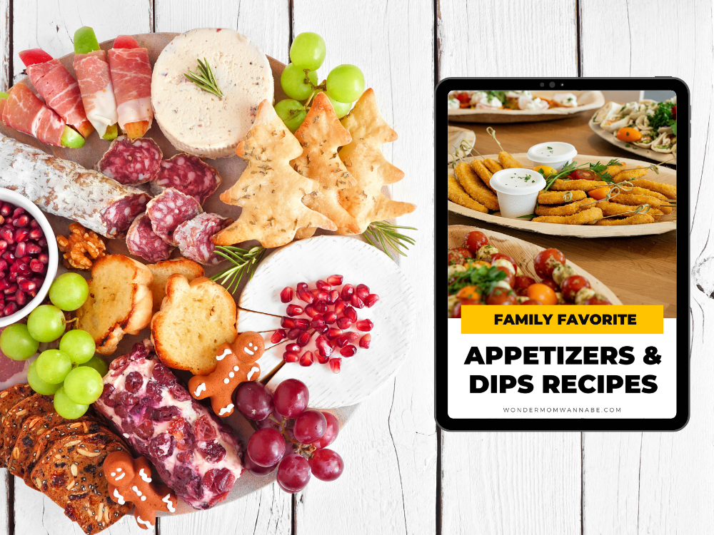 A charcuterie board with meats, cheeses, fruits, nuts, and crackers pairs perfectly with a tablet showing Wondermom Shop's "Appetizers & Dips Cookbook: Crowd-Pleasing Recipes for Every Occasion," ideal for creating bite-sized appetizers.