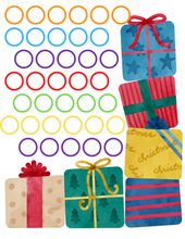 Load image into Gallery viewer, A set of Christmas Roll and Color Dice Game gift boxes with festive ribbons on them from Wondermom Shop.
