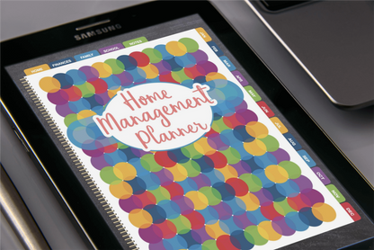 A digital Home Management Planner Bundle displayed on a Samsung tablet, featuring a colorful dotted cover design and including a Utilities Tracker by Wondermom Shop.