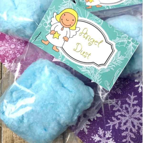 A VIP Vault Christmas Angel Treat Bag Toppers with a blue snow powder and an angel design.