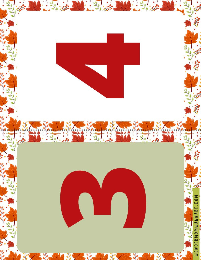 The image features two stylized numbers. At the top, in red, is the number "4" and at the bottom, also in red, is the number "3." The background showcases a decorative autumn leaf border. This design is perfect for incorporating into the Wondermom Shop's Fall Festival Party Kit or for adding to other printable elements in your digital product collection.