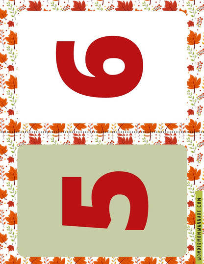 This Wondermom Shop digital product from the Fall Festival Party Kit showcases an image of the number six and an upside-down number five, encased in a fall-themed leaf border, making it ideal for your autumn celebration.