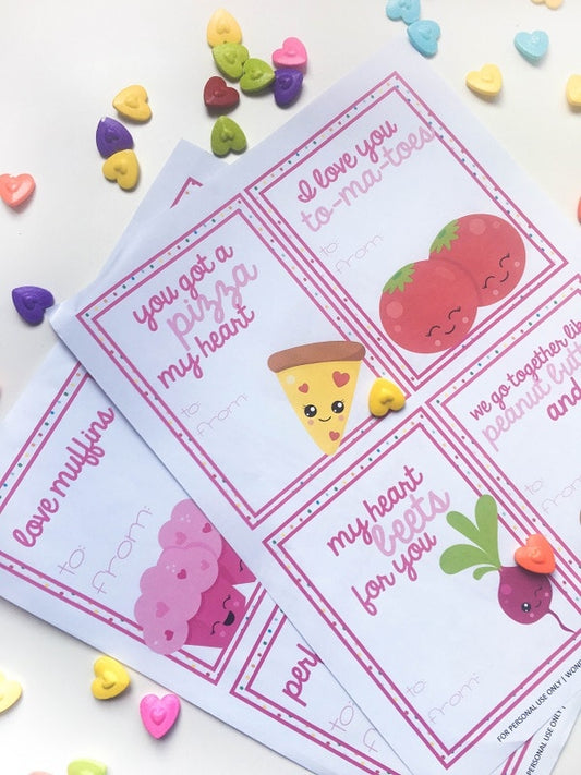VIP Vault's Printable Punny Food Valentines feature delightful illustrations of pizza, tomatoes, muffins, and beets. These charming digital valentines come with free printables surrounded by colorful heart candies for a sweet touch.