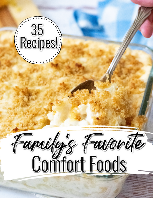 A dish of baked macaroni and cheese with breadcrumbs, with text: "Wondermom Wannabe – Family's Favorite Comfort Food Recipes Digital Cookbook: 35 easy-to-follow recipes your family will love!.