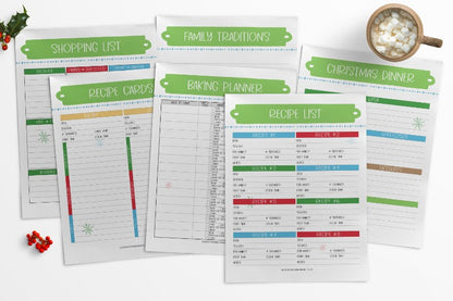 A set of Wondermom Shop's "The Most Wonderful Time of the Year Christmas Planners" on a table next to a cup of coffee.